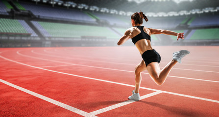 Fototapeta premium Sportswoman running race. Mixed media