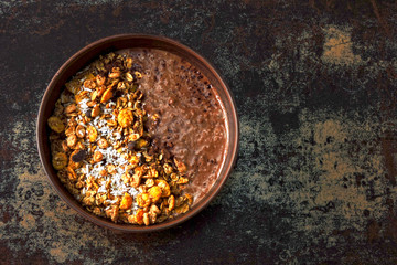Chocolate breakfast bowl with granola and chocolate yogurt.