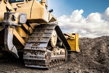 Fotobehang Vrachtwagen bulldozer moving dirt on the construction site  © Miljan Živković