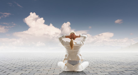 Businesswoman in lotus pose. Mixed media