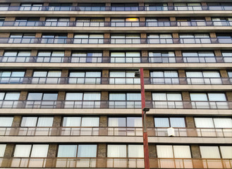 Fototapeta premium Apartment building glass windows and balcony background summer tone
