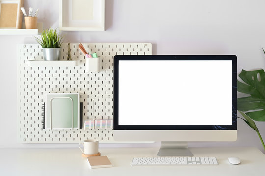 Modern home office, mockup blank screen desktop computer on white workspace
