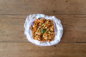 deep-fried unripe rice and grated coconut banana rolls