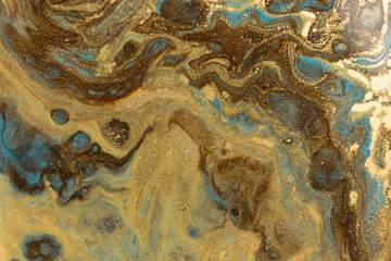 Gold marbling texture design. Blue and golden marble pattern. Fluid art.