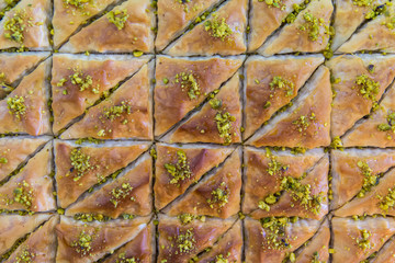 Baklava dessert. A sweet treat made with dough, honey, and pistachios, served in a Mediterranean restaurant. Dessert from Greece. 