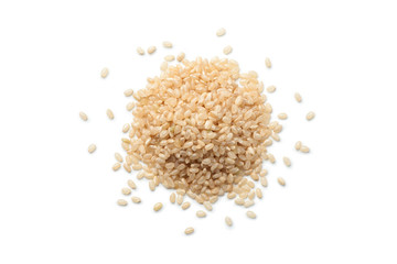Pile of brown rice isolated on white background, Top view.