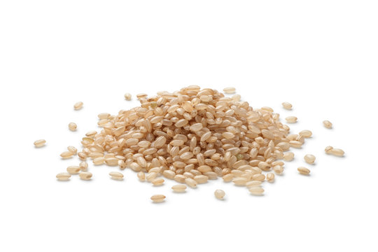 Pile of brown rice isolated on white background
