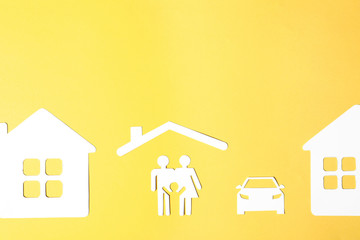 Flat lay composition with paper silhouette of family and space for text on color background. Life...