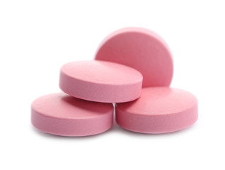 Pile of color pills on white background