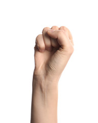 Young woman showing clenched fist on white background