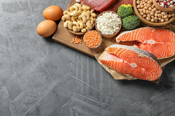 Different natural food on table, top view with space for text. High protein diet