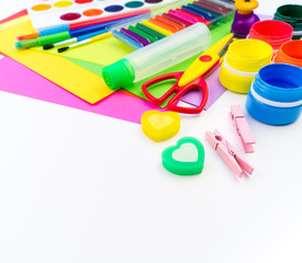 School accessories are laid out in the form of a rainbow. white background. Copy space.