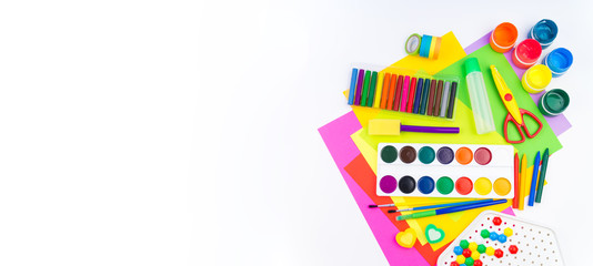 School accessories are laid out in the form of a rainbow. white background. Copy space. Banner