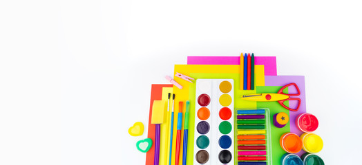 School accessories are laid out in the form of a rainbow. white background. Copy space. Banner