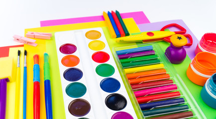 School accessories are laid out in the form of a rainbow. white background.