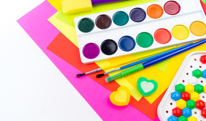 School accessories are laid out in the form of a rainbow. white background.
