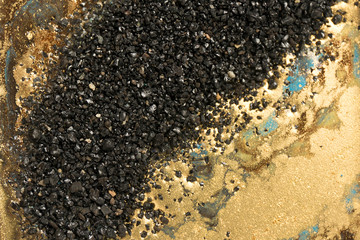Gold marbling texture design. Black and golden marble pattern. Fluid art.