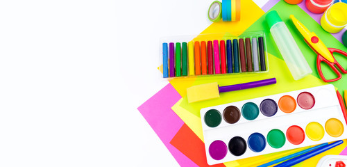 School accessories are laid out in the form of a rainbow. white background. Copy space. Banner