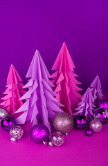 Christmas tree made of pink and purple craft paper.
