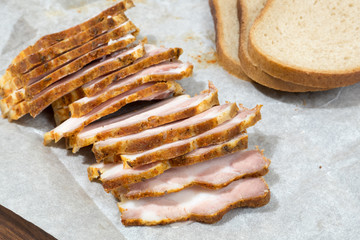 English bacon sliced with bread on Kraft paper