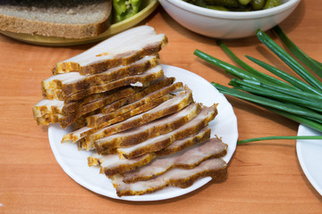 English bacon sliced on a white plate