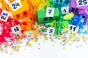 Advent calendar for kids rainbow color. House and Christmas tree paper craft.