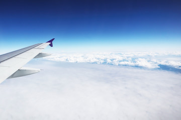 Fototapeta premium Dramatic atmosphere panorama view of beautiful blue sky and soft white clouds from aircraft.