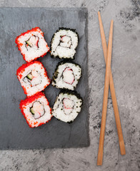 Sushi on stone background.
