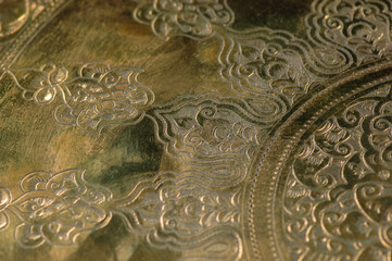 Eastern engraving on bronze, close-up