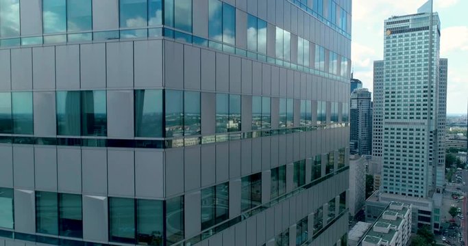 Dynamic aerial shot of skycraper in european city 