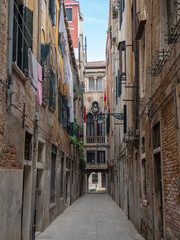Fototapeta na wymiar Venice, Italy. Views through the narrow pedestrian street of the town