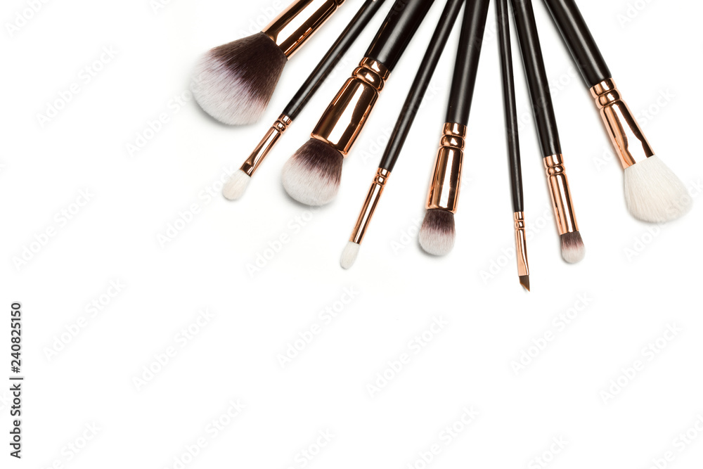 Wall mural Set of brushes for powder. Powder brush set. Cosmetic brush. Cosmetic product. Powder brush over white background. Cosmetic set. Make up brushes. Make up set. Isolated brushes on white background