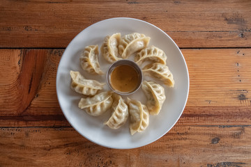 Eating Nepalese Traditional Dish Momo. Authentic Cuisine in Nepal