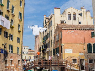 Fototapeta na wymiar Venice, Italy. Buildings of the Jewish quarter with laundry hanging on the wires between one house and another