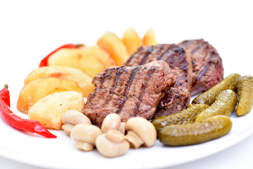 Meat dish. Delicious food. Steak with vegetables.
