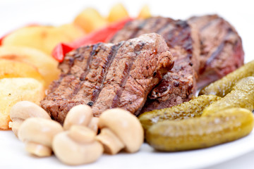 Meat dish. Delicious food. Steak with vegetables.