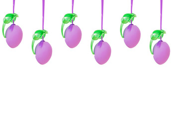 violet easter eggs hang on silk ribbon isolated on white backgound. Easter decoration and celebration concept.