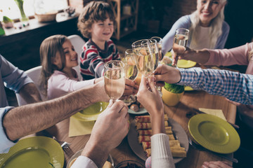 Cropped close-up view of nice cheerful positive family small lit