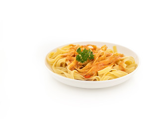 Plate full of spaghetti pasta with tomatoes