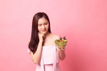 Young Asian woman not happy hate  salad