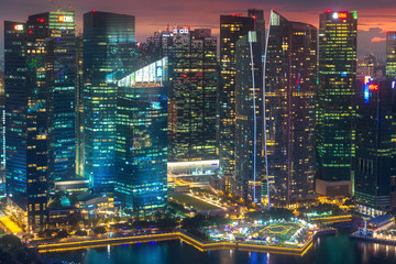 The close up view of the Central Business District (CBD) around the Marina Bay in Singapore in twilight time.