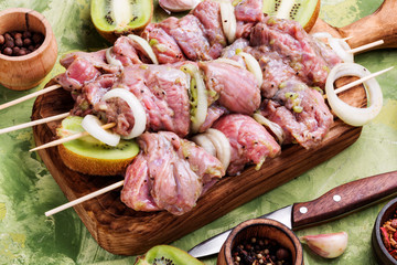 Fresh raw beef meat fillet shish kebab on skewers.Kiwi soaked meat.