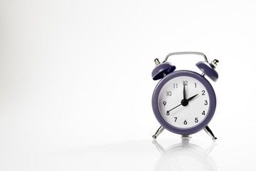 Dark alarm clock with shadow and space for your presentation text.