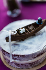 wedding cake with canoe as top piece