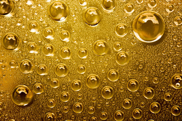 Water Drops On Gold Background