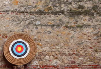 big target during the archery competition and old wall
