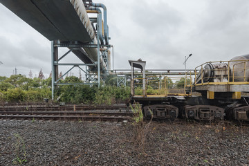 cargo trains stopped on old railroad in abandoned industrial site