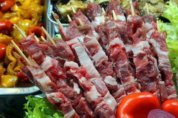 skewers of raw meat and vegetables in the company canteen