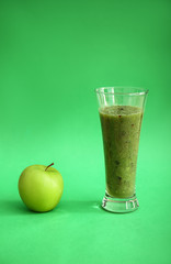 Glass of healthy smoothie on color background