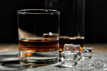 Glass of whiskey on table